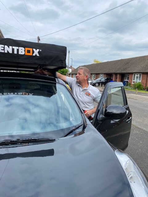 TentBox Lite 2.0 roof tent being fitted to a car.