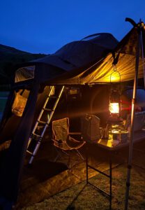 TentBox Lite 2.0 Living Pod in use, at night.